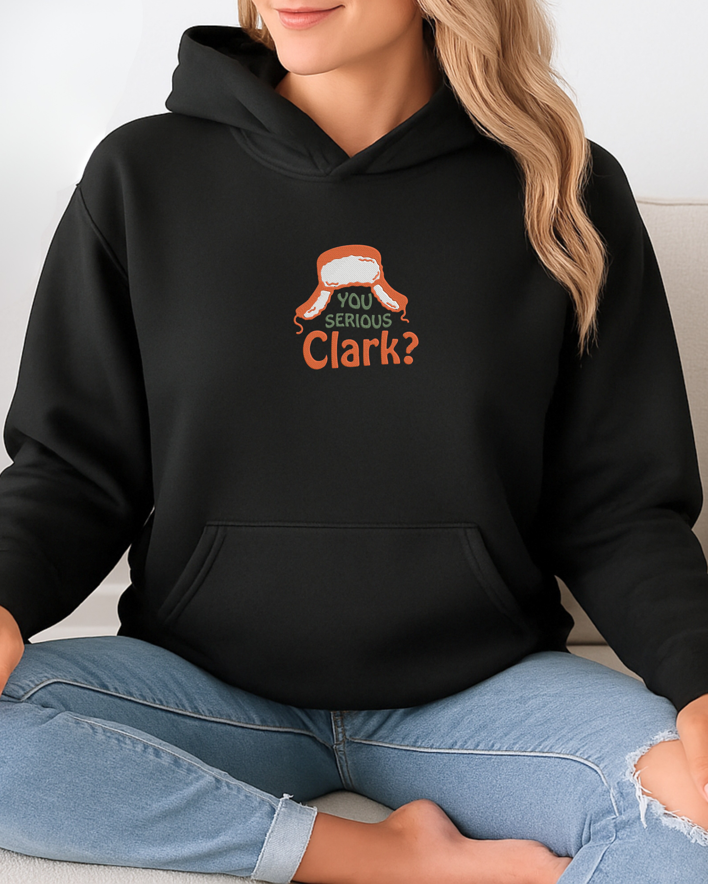 You Serious Clark embroidered on a black hoodie