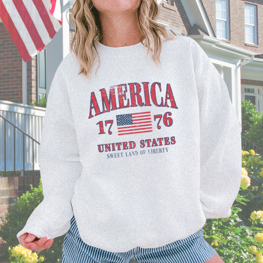 Distressed vintage America 1776 design on crewneck