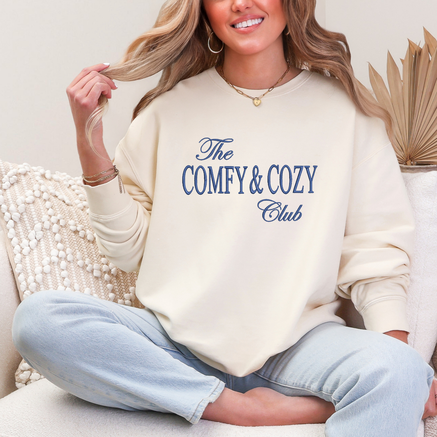 Cream crewneck with The comfy and cozy club embroidered in navy 