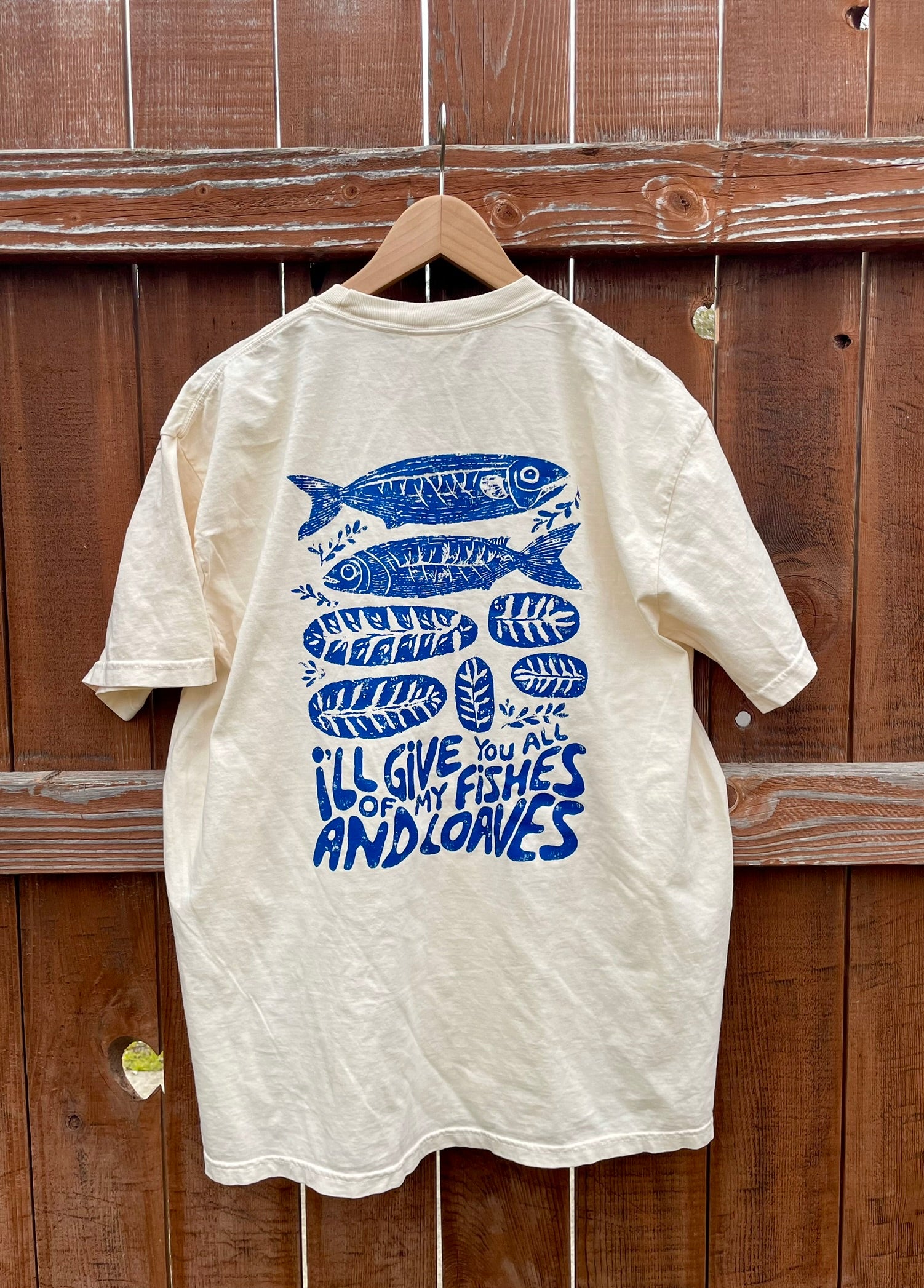 Ivory Comfort Colors tee with navy Fishes and Loaves design
