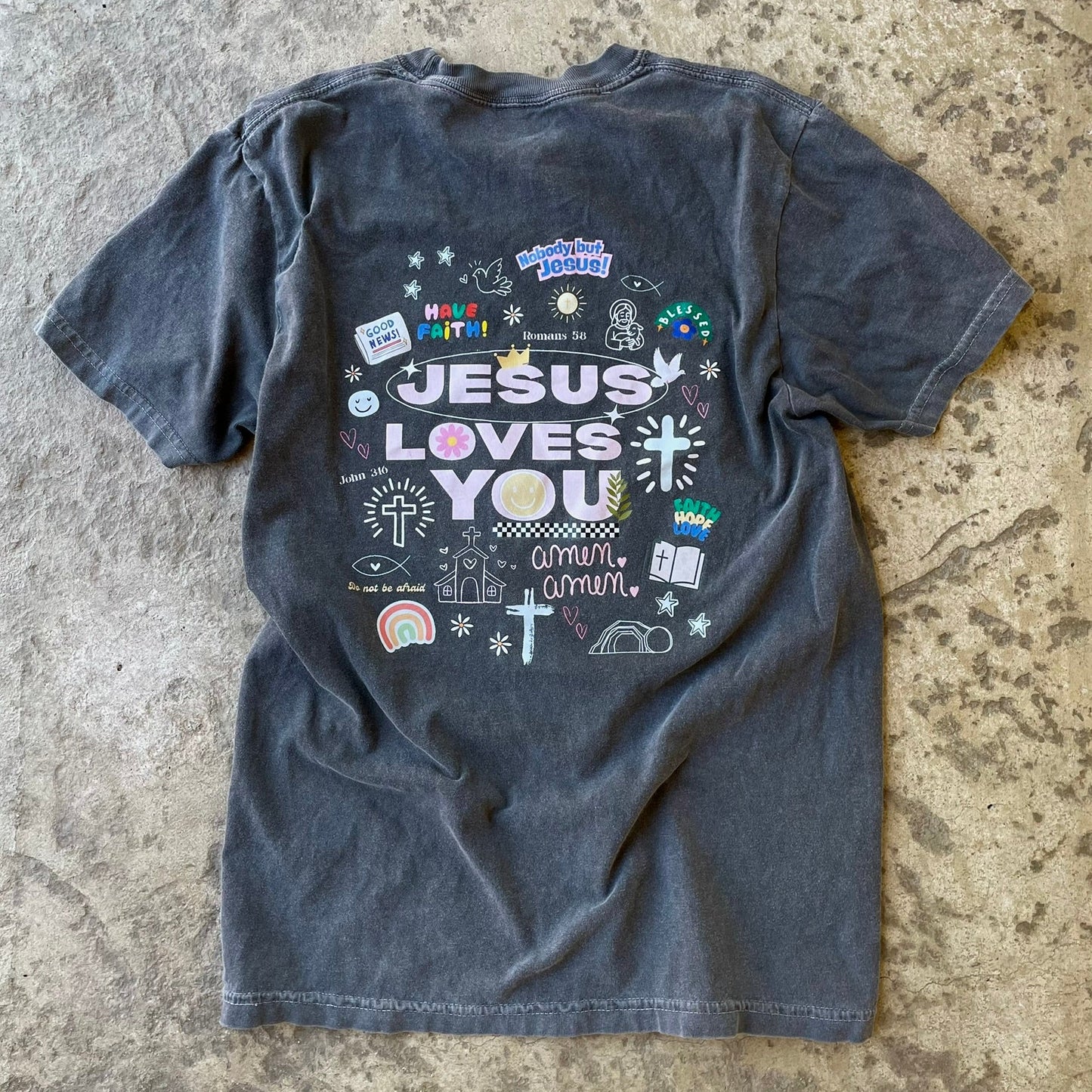 Jesus love you graphic design on back of comfort colors pepper t-shirt