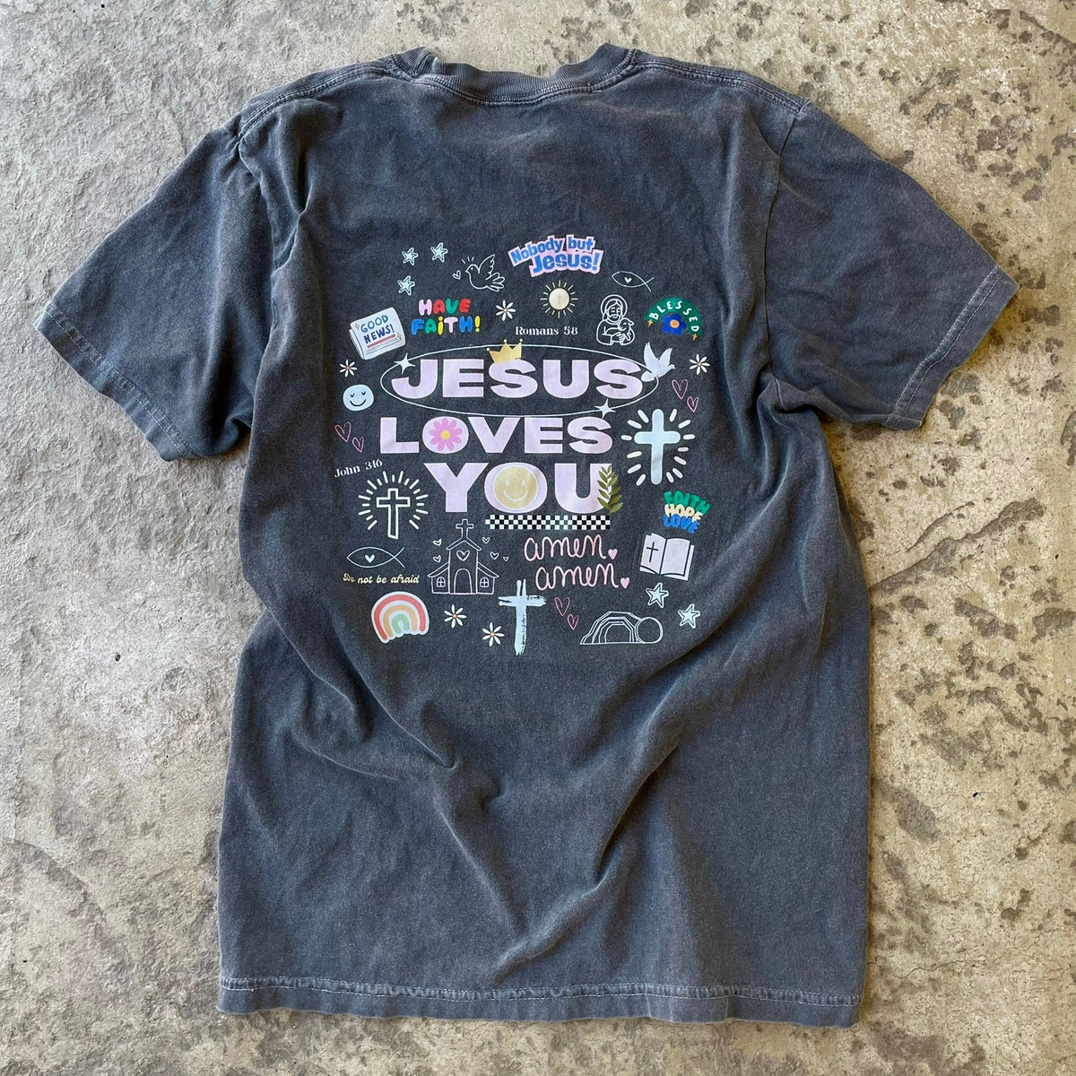 Jesus love you graphic design on back of comfort colors pepper t-shirt