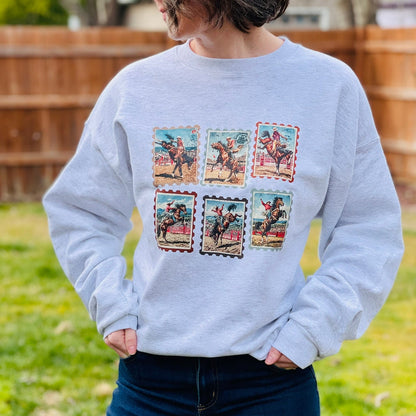 Vintage western rodeo stamps on heather gray crewneck sweatshirt.