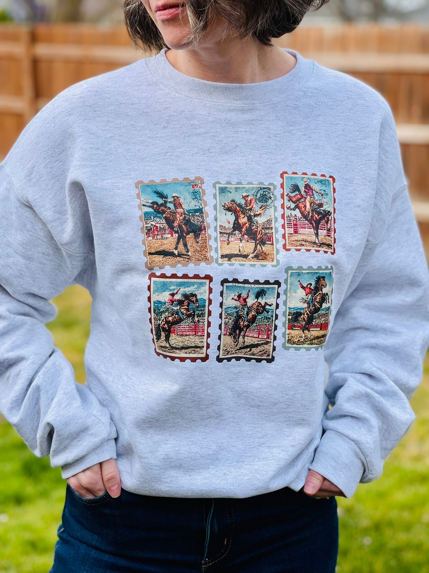 Vintage western rodeo stamps on heather gray crewneck sweatshirt.
