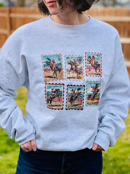 Vintage western rodeo stamps on heather gray crewneck sweatshirt.