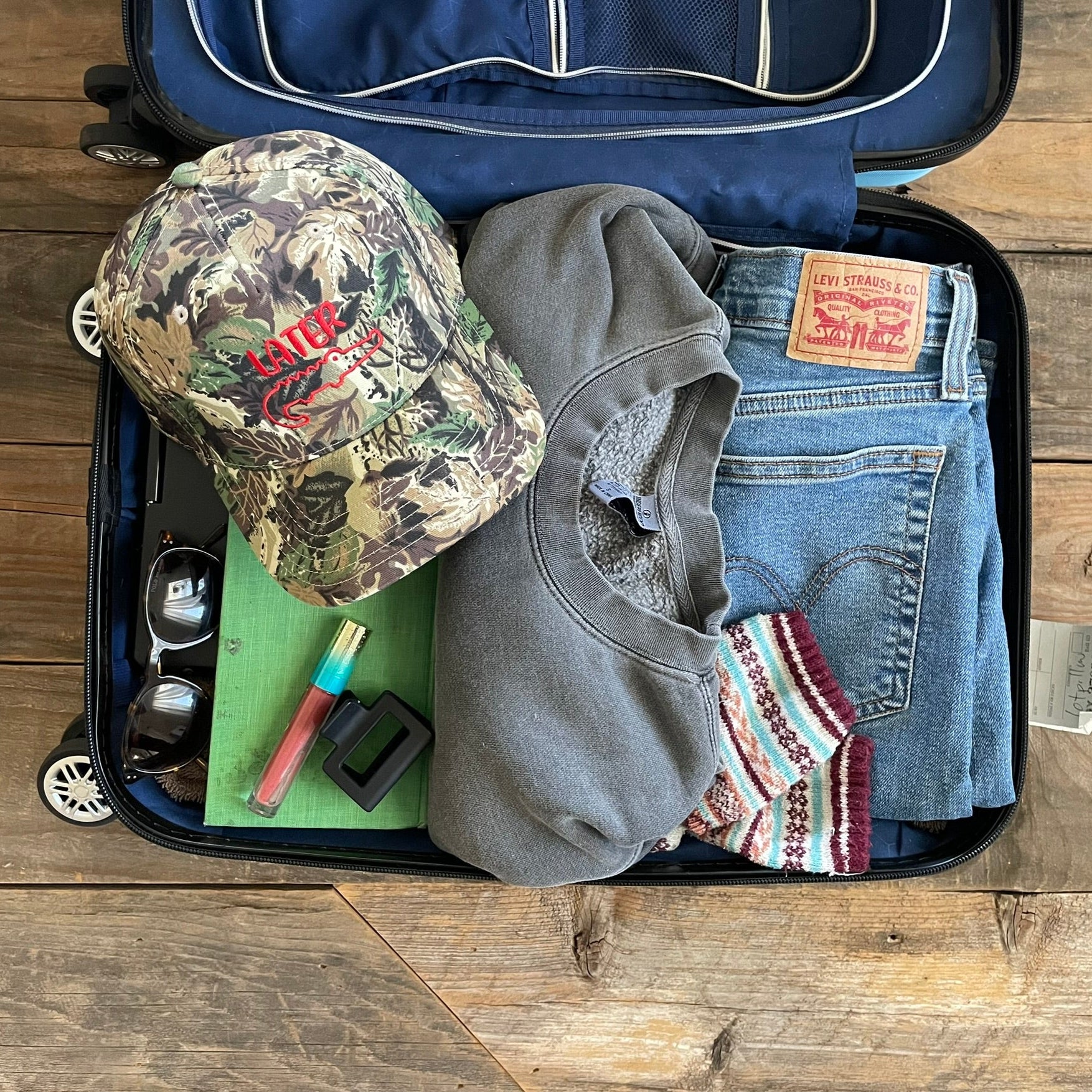 Camouflage hat with Later and a gator embroidered on it