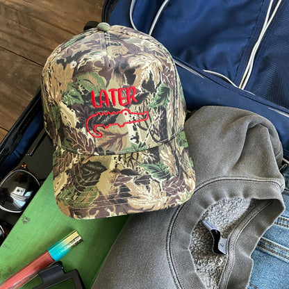Camouflage hat with red later gator design