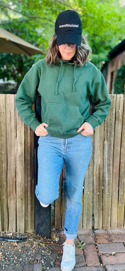 overstimulated embroidered on a black dad hat
