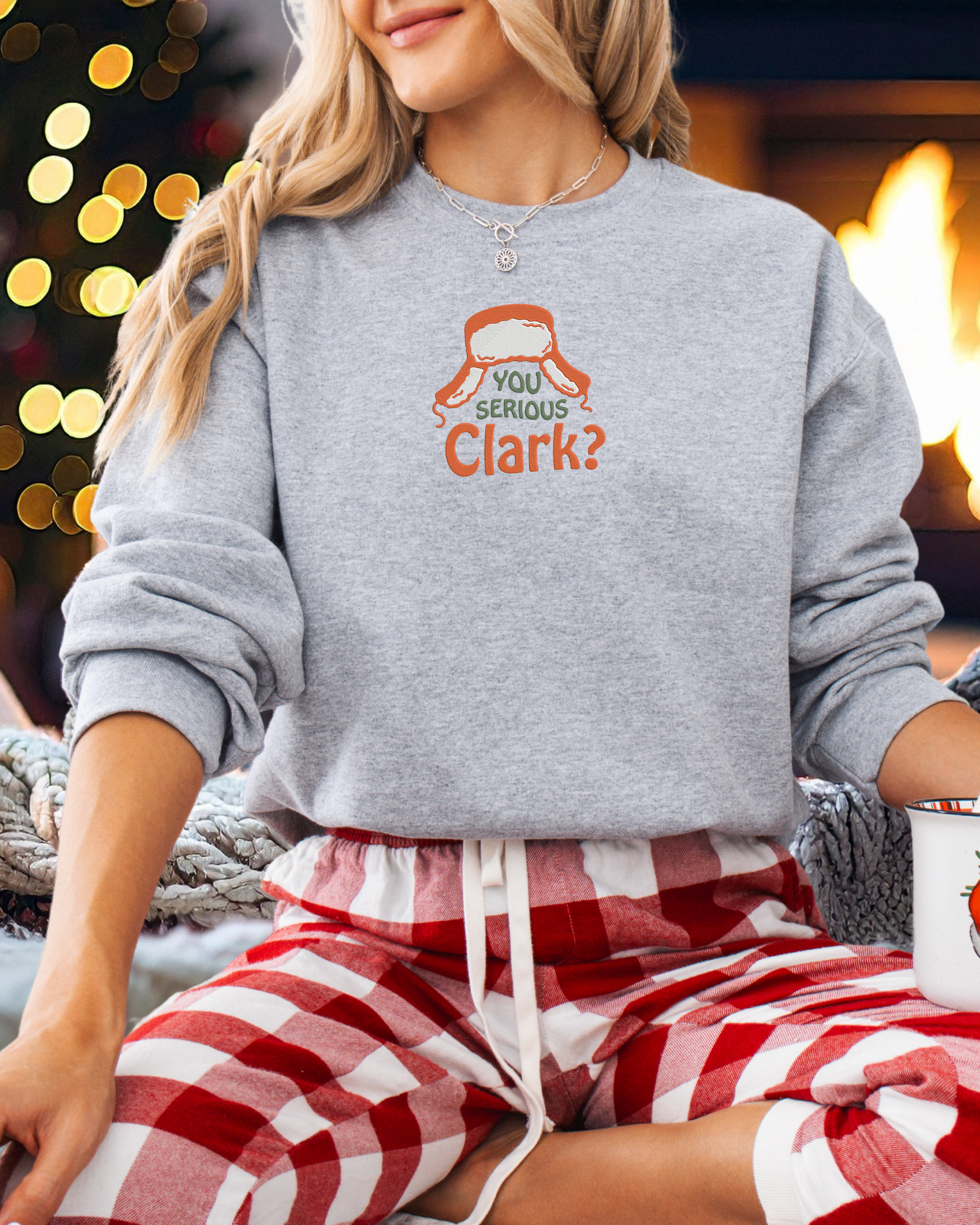 You Serious Clark embroidered on a gray crewneck
