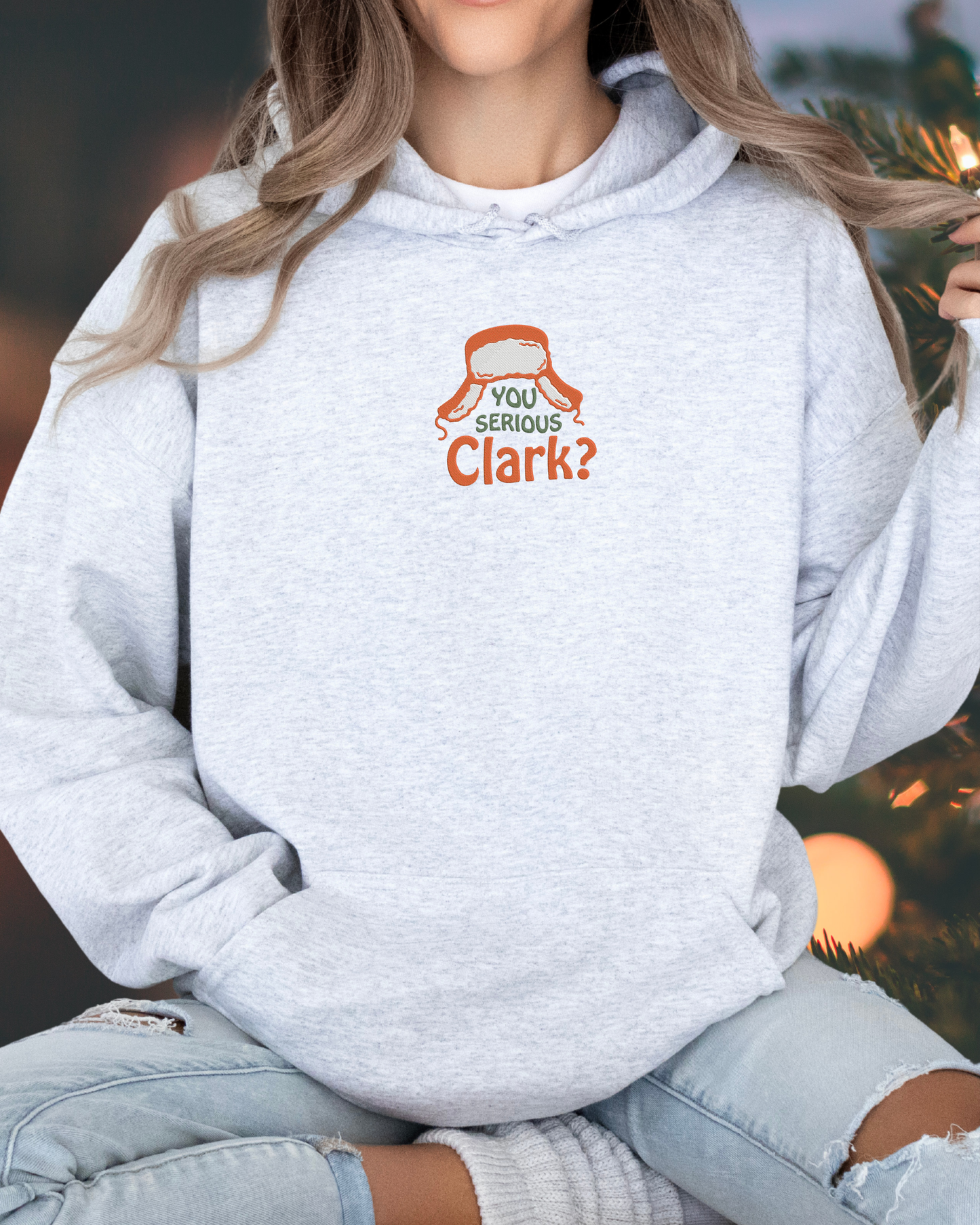 You Serious Clark embroidered on a gray hooded sweatshirt